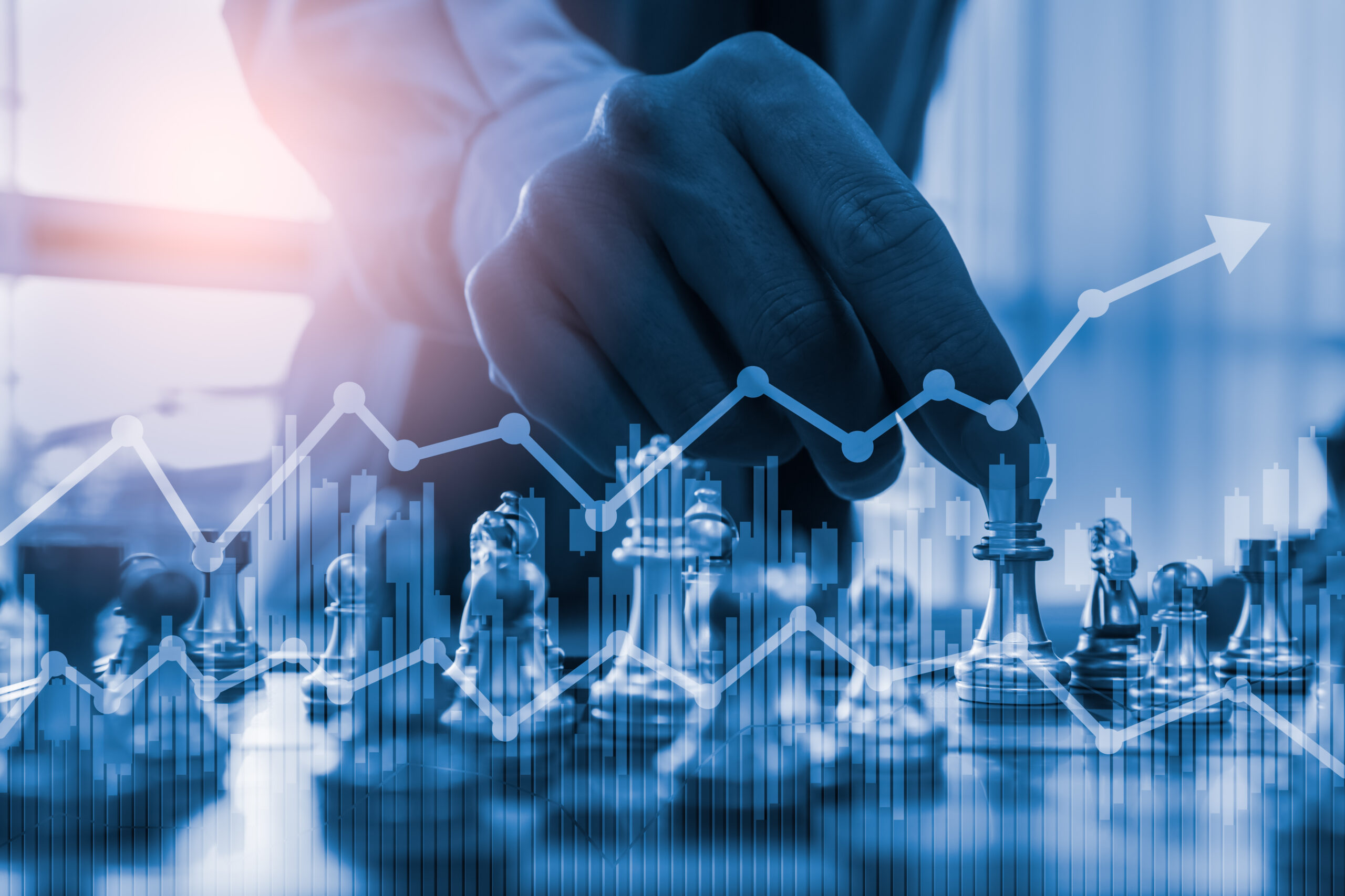 digital composite image businessman playing chess with graph desk scaled
